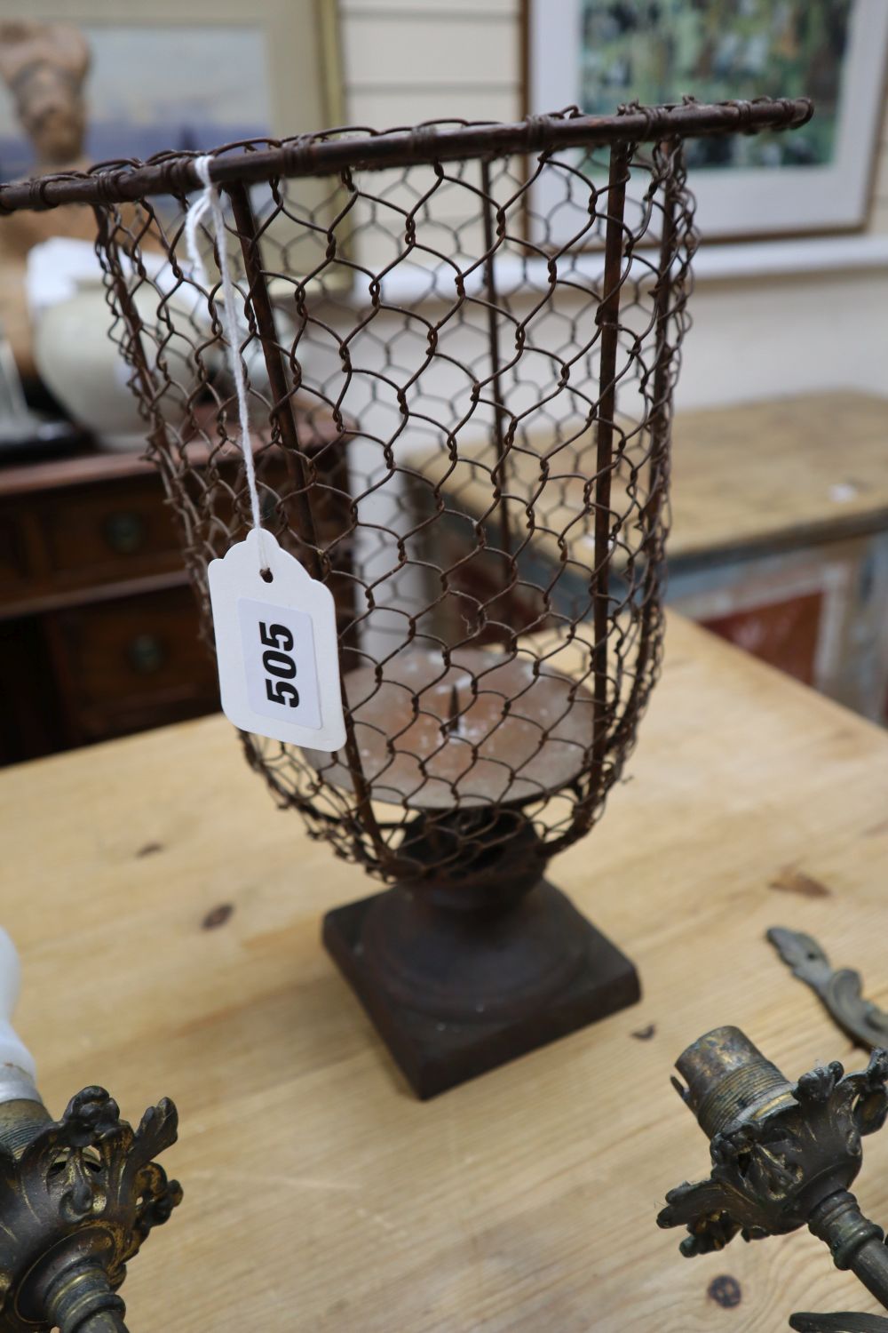 A pair of Louis XV style gilt metal two branch wall lights, and a metal wire framed pricket candle holder, 33cm